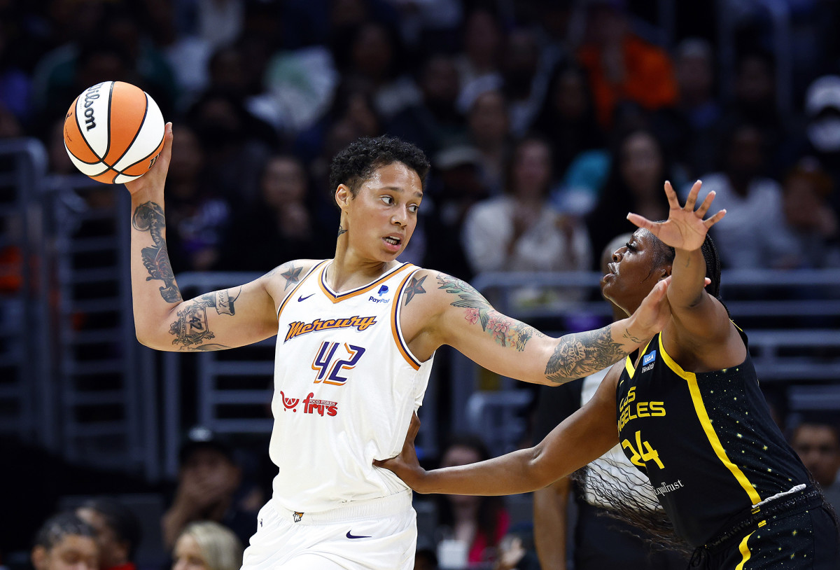 Brittney Griner controls the ball against Joyner Holmes
